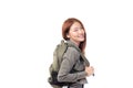Portrait of happy Asian girl student wearing denim jacket with backpack smiling and looking at camera isolated on white background Royalty Free Stock Photo
