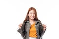 Portrait of happy Asian girl student wearing denim jacket with backpack smiling and looking at camera isolated on white background Royalty Free Stock Photo