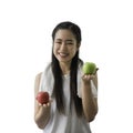 Portrait of happy Asian healthy woman holding green apple at left hand and red apple at right hand isolated on white background Royalty Free Stock Photo