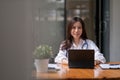 Portrait happy asian woman doctor looking at camera, Telemedicine concept. Asian female doctor talking with patient Royalty Free Stock Photo