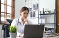 Portrait happy asian woman doctor, Telemedicine concept. Asian female doctor talking with patient using laptop online video Royalty Free Stock Photo