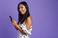 Portrait of a happy asian woman in dress standing isolated Royalty Free Stock Photo