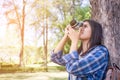 happy Asian woman taking photos with a DSLR camera Royalty Free Stock Photo