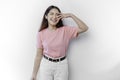A portrait of a happy Asian woman wearing a pink blouse isolated by white background Royalty Free Stock Photo