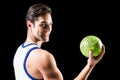 Portrait of happy athlete man holding ball