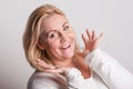 Portrait of an attractive overweight woman in studio on a white background.