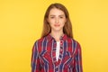 Portrait of happy attractive ginger girl in checkered shirt looking at camera with positive cheerful expression, clean face skin Royalty Free Stock Photo