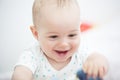 Portrait of a happy baby boy playing on floor in children& x27;s room Royalty Free Stock Photo