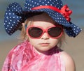 Portrait of happy baby girl in hat and sunglasses Royalty Free Stock Photo