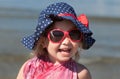 Portrait of happy baby girl in hat and sunglasses Royalty Free Stock Photo