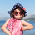 Portrait of happy baby girl in hat and sunglasses Royalty Free Stock Photo