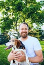 Portrait of happy bearded man embracing his dog Royalty Free Stock Photo
