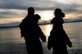 Portrait of happy beautiful family four together at sunset Royalty Free Stock Photo