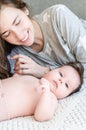 Portrait of happy beautiful mother and cute newborn baby girl