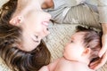 Portrait of happy beautiful mother and cute newborn baby girl Royalty Free Stock Photo