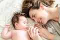 Portrait of happy beautiful mother and cute newborn baby girl Royalty Free Stock Photo