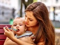 Portrait of happy beautiful mother feed her baby Royalty Free Stock Photo