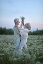 Portrait of happy beautiful senior couple dancing in summer park Royalty Free Stock Photo