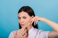 Portrait of a happy beautiful smiling woman touching her face isolated Royalty Free Stock Photo