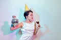 Portrait of a happy beautiful woman in white dress having a party and drinking champagne while standing with disco ball Royalty Free Stock Photo