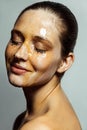 Portrait of happy beautiful young brunette woman with freckles and honey on face with closed eyes and smile happiness face Royalty Free Stock Photo