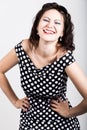 Portrait of happy beautiful young woman licking chupa chups. pretty woman with heart shaped lollipop Royalty Free Stock Photo