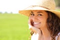 Portrait of a happy beauty woman smiling at you in a field Royalty Free Stock Photo