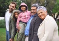 Portrait, happy and big family together in nature at garden for bonding, relationship or love at backyard. Face, park Royalty Free Stock Photo