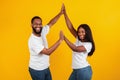 Portrait of happy black couple celebrating win giving high five Royalty Free Stock Photo