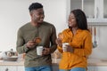 Portrait Of Happy Black Couple Drinking Coffee And Eating Cookies In Kitchen Royalty Free Stock Photo
