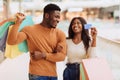 Portrait of happy black couple holding credit card Royalty Free Stock Photo