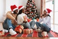 Portrait of happy black family celebrating Christmas exchanging presents Royalty Free Stock Photo