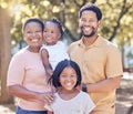 Portrait of a happy black family in nature in a garden for summer picnic while on holiday. Smile, love and african Royalty Free Stock Photo