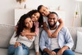 Portrait of a happy black family posing at camera Royalty Free Stock Photo