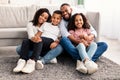 Portrait of a happy black family posing at camera Royalty Free Stock Photo