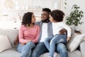 Portrait of happy black family resting together on couch at home Royalty Free Stock Photo