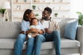 Portrait of happy black family smiling looking at each other Royalty Free Stock Photo