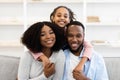 Portrait of happy black family smiling posing for photo Royalty Free Stock Photo