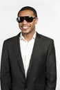 Portrait Of A Happy Black Male In Suit and Sunglasses