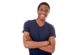 Happy black man smiling with arms crossed against isolated white background Royalty Free Stock Photo