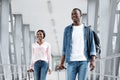 Portrait Of Happy Black People Walking At Airport Terminal With Suitcases Royalty Free Stock Photo