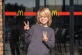 portrait happy blonde boy near doors logo McDonalds fast food Restaurant 23.03.20 Kemer Turkey