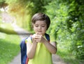 Portrait happy boy counting on his fingers,4 year old count the number, School kid learning number with his fingers while waitting