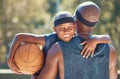 Portrait of happy boy with father and basketball outdoor after training, workout or practice. Black father carrying his Royalty Free Stock Photo