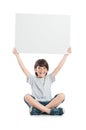 Portrait of happy boy holding sign Royalty Free Stock Photo