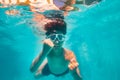 Cute boy in scuba mask swim and pose underwater Royalty Free Stock Photo