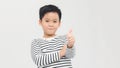 Portrait of happy boy showing thumbs up gesture, isolated over white background Royalty Free Stock Photo