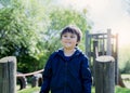 Portrait happy boy with smiling face playing in the park, Active kid having fun in the playground on sunny day summer, Healhty Royalty Free Stock Photo