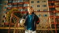 Portrait of a Happy Boy Wearing a Sport Coat Holding a Soccer Ball in the Backyard Young Football Royalty Free Stock Photo