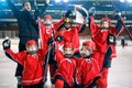 Portrait of happy boys players team ice hockey